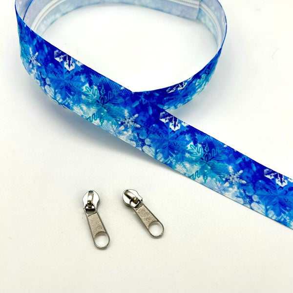 PRECUT 1 METRE ZIPPER TAPE + 2 ZIP PULLS: Blue Snowflake with 2 Silver colour pulls